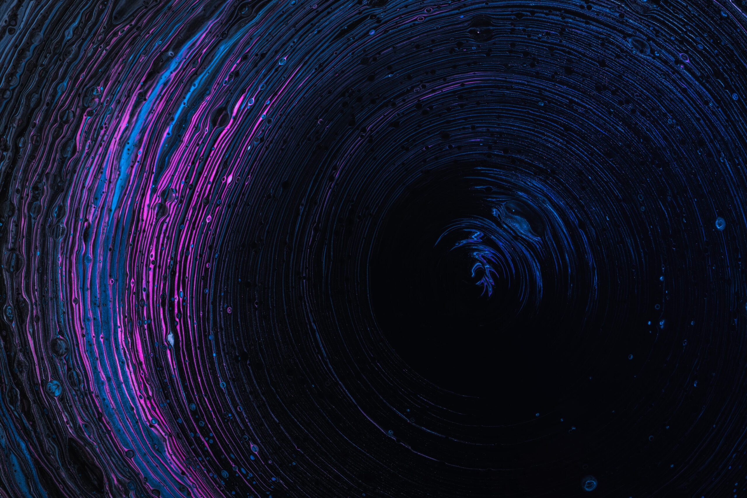 void, blue and pink swirls on a black backround